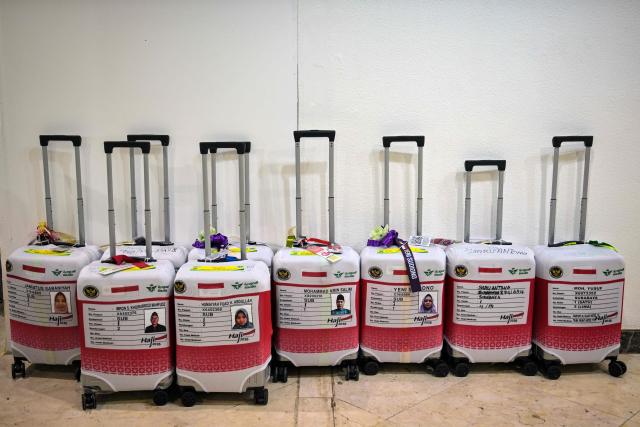 Pilgrims luggages are seen before departing for the holy city of Mecca to perform the annual Hajj, at Juanda International Airport in Sidoarjo on April 22, 2026. (Photo by JUNI KRISWANTO / AFP)
