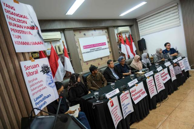 Activists hold a press conference at the National Commission on Violence Against Women office in Jakarta on April 22, 2026. (Photo by BAY ISMOYO / AFP)