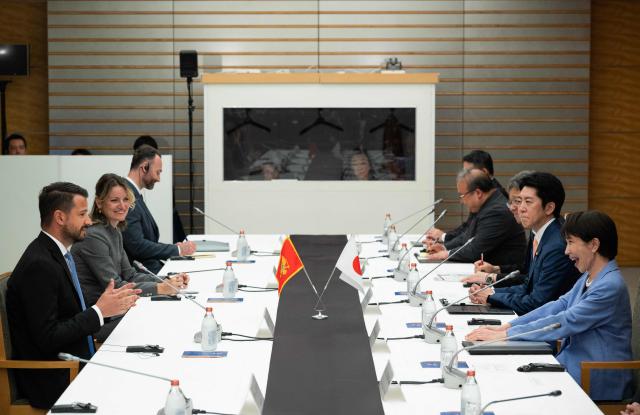 Japan's Prime Minister Sanae Takaichi (R) meets with Montenegro's President Jakov Milatovic (L) at the prime minister's office in Tokyo on April 22, 2026. (Photo by Andrew CABALLERO-REYNOLDS / AFP)