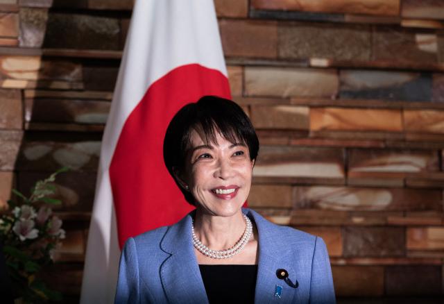 Japan's Prime Minister Sanae Takaichi smiles as she meets with Montenegro's President Jakov Milatovic before a meeting at the prime minister's office in Tokyo on April 22, 2026. (Photo by Andrew CABALLERO-REYNOLDS / AFP)