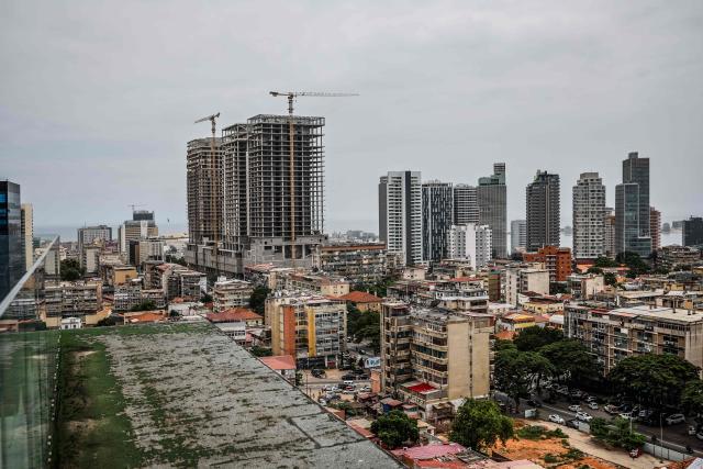 A general view of the construction on high-rise buildings in the capital of Luanda on April 21, 2026. (Photo by Phill Magakoe / AFP)