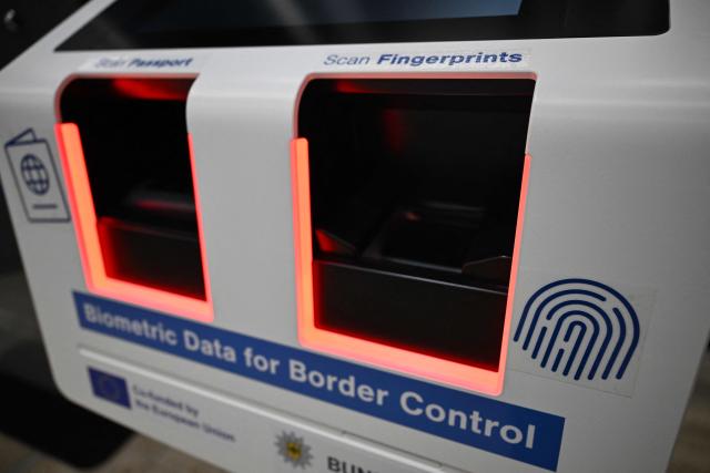 A device for biometric data for border control is pictured at the Terminal 3 at the Frankfurt International airport on the day of the official inauguration of new Terminal 3 on April 22, 2026 in Frankfurt, western Germany. (Photo by Kirill KUDRYAVTSEV / AFP)