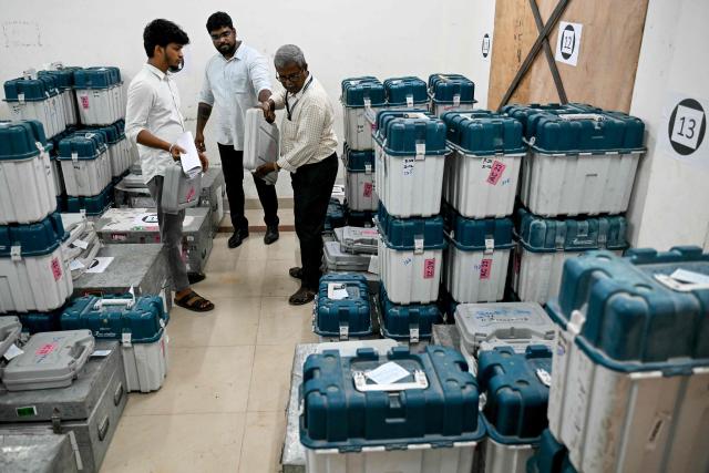 Election officials sort polling materials before they are dispatched to polling stations on the eve of the 2026 Tamil Nadu Legislative Assembly elections in Chennai on April 22, 2026. (Photo by R. Satish BABU / AFP)