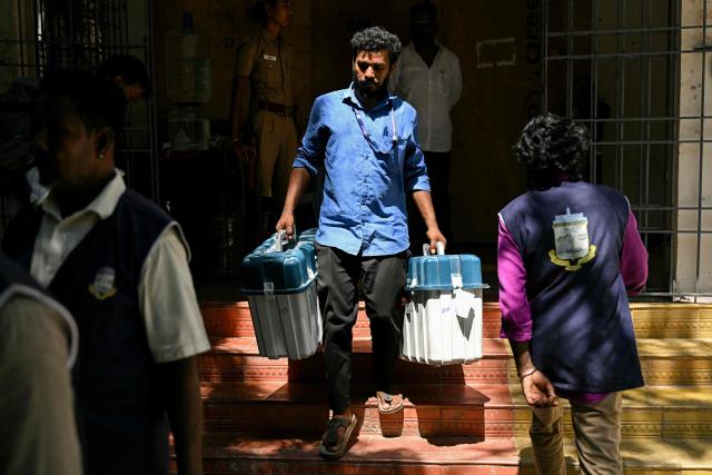 An election official loads polling materials onto a truck before they are dispatched to polling stations on the eve of the 2026 Tamil Nadu Legislative Assembly elections in Chennai on April 22, 2026. (Photo by R. Satish BABU / AFP)