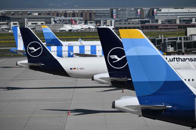 Aircrafts of German airline Lufthansa sit on the tarmac at the Frankfurt International airport on the day of the official inauguration of new Terminal 3 on April 22, 2026 in Frankfurt, western Germany. (Photo by Kirill KUDRYAVTSEV / AFP)