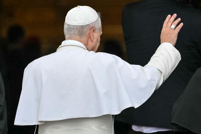Pope Leo XIV waves as he arrives to lead a Holy Mass at the Basilica of the Immaculate Conception in Mongomo on the tenth day of an 11-day apostolic journey to Africa, on April 22, 2026. (Photo by Alberto PIZZOLI / AFP)