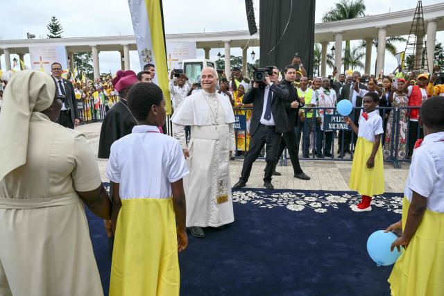 Pope Leo XIV smiles as he arrives to lead a Holy Mass at the Basilica of the Immaculate Conception in Mongomo on the tenth day of an 11-day apostolic journey to Africa, on April 22, 2026. (Photo by Alberto PIZZOLI / AFP)