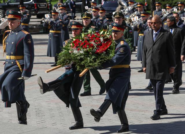 Seychelles' President Patrick Herminie attends a wreath-laying ceremony at the Tomb of the Unknown Soldier near the Kremlin wall in Moscow on April 22, 2026. (Photo by MAXIM SHIPENKOV / POOL / AFP)