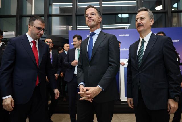 NATO Secretary General Mark Rutte (C), Turkey's Defence Industry President Haluk Gorgun (R) and CEO of Aselsan Ahmet Akyol (L) visit Aselsan Defence company as part of Rutte's official visit to Turkey, in Ankara on April 22,2026. NATO chief Mark Rutte said the alliance would do "what's necessary to defend" its members including Turkey after intercepting four missiles fired from Iran and head into Turkish air space over the past weeks. (Photo by Adem ALTAN / AFP)