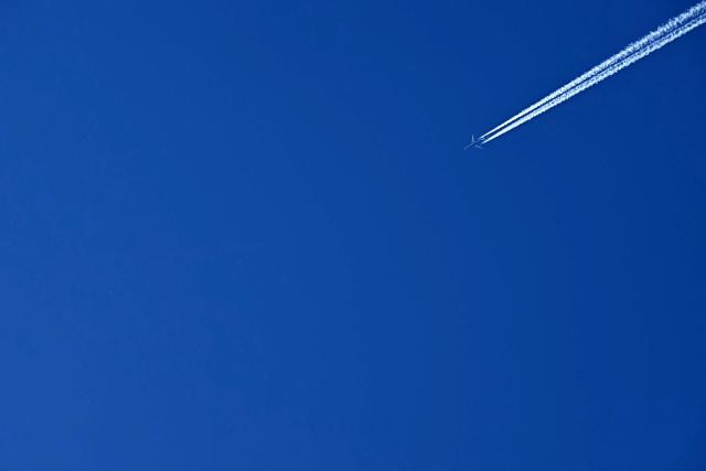 A British Airways aircraft creates vapour trails or contrails as it is flown towards London from Chicago, pictured from Liverpool, north west England on April  22, 2026. The EU unveiled on April 22 plans to address the energy crisis triggered by the war in the Middle East, including improved monitoring of jet fuel supplies as the prospect of shortages rattles Europe ahead of the summer travel season. (Photo by Paul ELLIS / AFP)