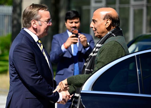German Defence Minister Boris Pistorius (L) welcomes his Indian counterpart Rajnath Singh ahead a welcoming ceremony at the Defence Ministry in Berlin, on April 22, 2026. (Photo by Tobias SCHWARZ / AFP)