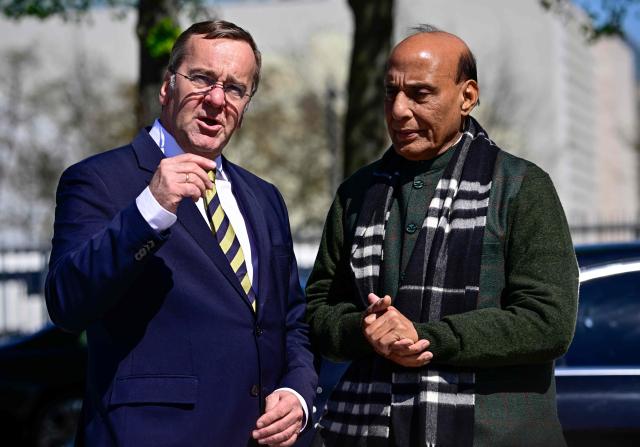 German Defence Minister Boris Pistorius (L) welcomes his Indian counterpart Rajnath Singh ahead a welcoming ceremony at the Defence Ministry in Berlin, on April 22, 2026. (Photo by Tobias SCHWARZ / AFP)