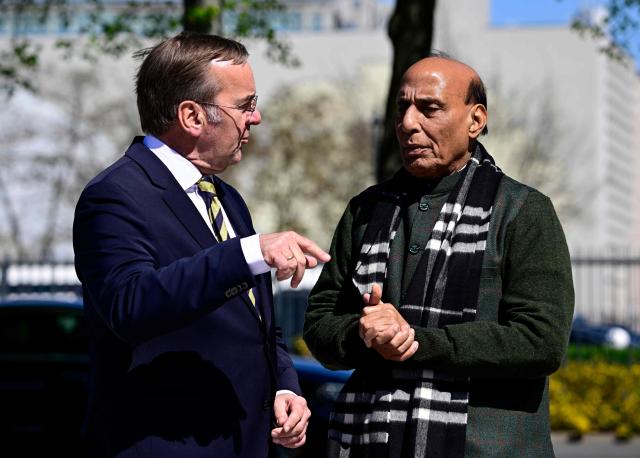 German Defence Minister Boris Pistorius (L) welcomes his Indian counterpart Rajnath Singh ahead a welcoming ceremony at the Defence Ministry in Berlin, on April 22, 2026. (Photo by Tobias SCHWARZ / AFP)