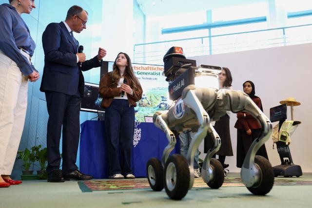 German Chancellor Friedrich Merz (2nd L) hosts the opening event of the annual "Girls' Day", a nationwide initiative empowering young women and girls to explore diverse career paths, at the Chancellery in Berlin, Germany April 22, 2026. (Photo by Lisi Niesner / POOL / AFP)