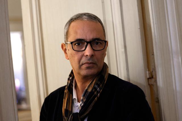 (FILES) Algerian writer and journalist Kamel Daoud attends a press conference at the Gallimard publishing house in Paris on December 11, 2024. The Franco-Algerian writer Kamel Daoud announced on April 22, 2026, that he had been sentenced to three years in prison without parole and a fine of five million dinars in Algeria, where he was being prosecuted for his novel "Houris," winner of the 2024 Goncourt Prize. (Photo by GEOFFROY VAN DER HASSELT / AFP)
