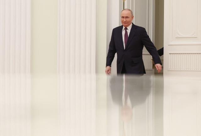 Russian President Vladimir Putin arrives for a meeting with Seychelles' President at the Kremlin in Moscow on April 22, 2026. (Photo by MAXIM SHIPENKOV / POOL / AFP)
