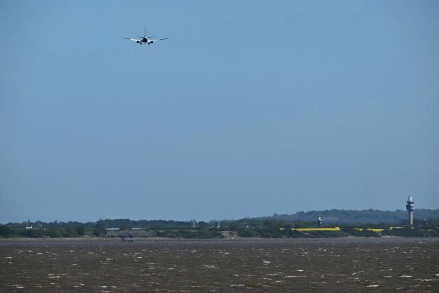 A RyanAir passenger aircraft prepares to land at Liverpool John Lennon Airport in Liverpool, north west England on April 22, 2026. The EU unveiled on April 22 plans to address the energy crisis triggered by the war in the Middle East, including improved monitoring of jet fuel supplies as the prospect of shortages rattles Europe ahead of the summer travel season. (Photo by Paul ELLIS / AFP)