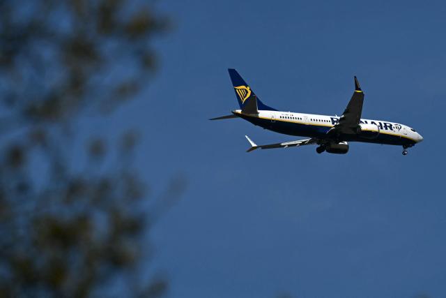 A RyanAir passenger aircraft prepares to land at Liverpool John Lennon Airport in Liverpool, north west England on April 22, 2026. The EU unveiled on April 22 plans to address the energy crisis triggered by the war in the Middle East, including improved monitoring of jet fuel supplies as the prospect of shortages rattles Europe ahead of the summer travel season. (Photo by Paul ELLIS / AFP)