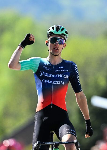 Decathlon CMA CGM Team's French Paul Seixas celebrates as he crosses the finish line to win 'La Fleche Wallonne' one day cycling race, 200 km from Herstal to Huy, on April 22, 2026. (Photo by JOHN THYS / AFP)