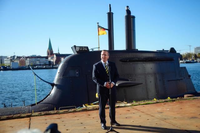 German Defence Minister Boris Pistorius speaks to journalists in front of a U-34 submarine as he visits the TKMS (ThyssenKrupp Marine Systems) submarine shipyard with his Indian counterpart in Kiel, northern Germany on April 22, 2026. (Photo by Gregor Fischer / AFP)