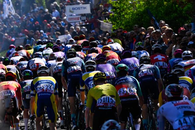 The pack rides on the "Mur de Huy" (Wall of Huy) during 'La Fleche Wallonne' one day cycling race, 200 km from Herstal to Huy, on April 22, 2026. (Photo by JOHN THYS / AFP)