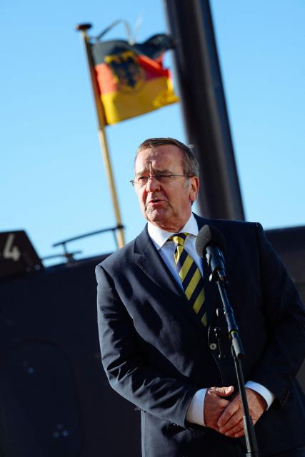 German Defence Minister Boris Pistorius speaks to journalists in front of a U-34 submarine as he visits the TKMS (ThyssenKrupp Marine Systems) submarine shipyard with his Indian counterpart in Kiel, northern Germany on April 22, 2026. (Photo by Gregor Fischer / AFP)