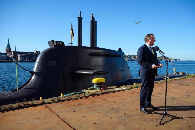German Defence Minister Boris Pistorius speaks to journalists in front of a U-34 submarine as he visits the TKMS (ThyssenKrupp Marine Systems) submarine shipyard with his Indian counterpart in Kiel, northern Germany on April 22, 2026. (Photo by Gregor Fischer / AFP)