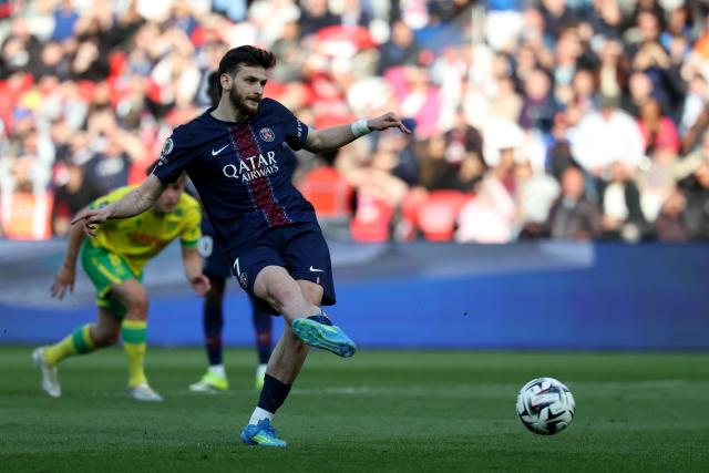 Paris Saint-Germain's Georgian forward #07 Khvicha Kvaratskhelia scores his team's first goal from the penalty spot during the French L1 football match between Paris Saint-Germain (PSG) and FC Nantes at the Parc des Princes stadium in Paris on April 22, 2026. (Photo by FRANCK FIFE / AFP)