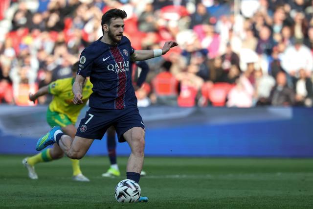 Paris Saint-Germain's Georgian forward #07 Khvicha Kvaratskhelia scores his team's first goal from the penalty spot during the French L1 football match between Paris Saint-Germain (PSG) and FC Nantes at the Parc des Princes stadium in Paris on April 22, 2026. (Photo by FRANCK FIFE / AFP)