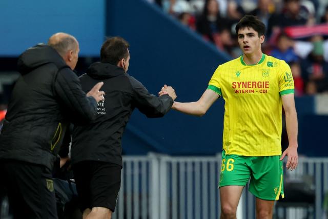Nantes' French midfielder #66 Louis Leroux (R) celebrates scoring his team's first goal which was ruled out by the VAR during the French L1 football match between Paris Saint-Germain (PSG) and FC Nantes at the Parc des Princes stadium in Paris on April 22, 2026. (Photo by FRANCK FIFE / AFP)