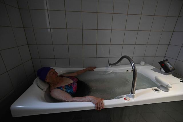 A patient receives their spa treatment at the Thermes de Balaruc-les-Bains, in Balaruc-les-Bains, southern France on April 22, 2026. Balaruc-les-Bains, which welcomes more than 52,000 spa visitors every year, is the leading spa in France, scientifically recognised for the quality of its thermal water since the 16th century. (Photo by Gabriel BOUYS / AFP)