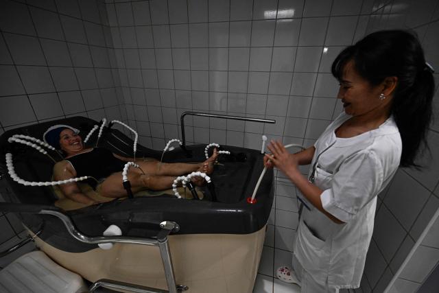 A patient receives their spa treatment at the Thermes de Balaruc-les-Bains, in Balaruc-les-Bains, southern France on April 22, 2026. Balaruc-les-Bains, which welcomes more than 52,000 spa visitors every year, is the leading spa in France, scientifically recognised for the quality of its thermal water since the 16th century. (Photo by Gabriel BOUYS / AFP)