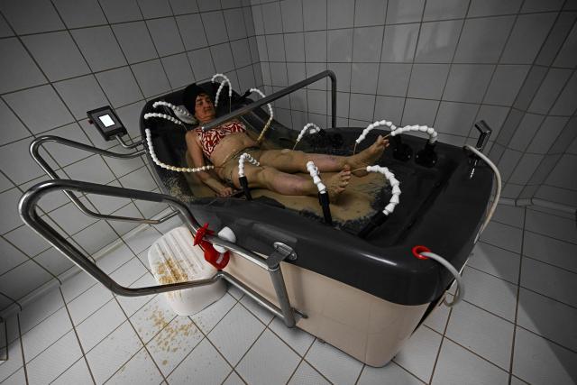 A patient receives their spa treatment at the Thermes de Balaruc-les-Bains, in Balaruc-les-Bains, southern France on April 22, 2026. Balaruc-les-Bains, which welcomes more than 52,000 spa visitors every year, is the leading spa in France, scientifically recognised for the quality of its thermal water since the 16th century. (Photo by Gabriel BOUYS / AFP)