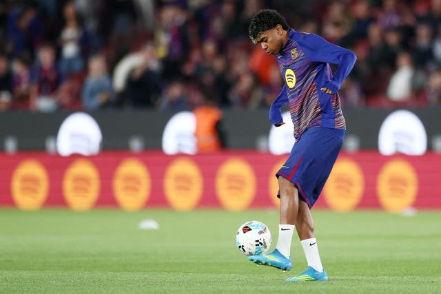 Barcelona's Spanish forward #10 Lamine Yamal warms up before the Spanish league football match between FC Barcelona and RC Celta de Vigo at Camp Nou stadium in Barcelona on April 22 , 2026. (Photo by Josep LAGO / AFP)