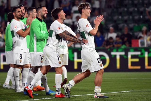 Elche's Austrian defender #22 David Affengruber (R) and teammates celebrate their victory at the end of the Spanish league football match between Elche CF and Club Atletico Madrid at Martinez Valero Stadium in Elche on April 22, 2026. (Photo by JOSE JORDAN / AFP)