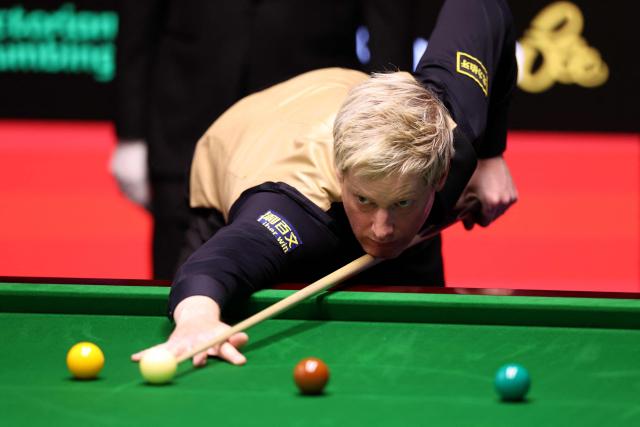 Australia's Neil Robertson plays a shot against China's Pang Junxu during the World Snooker Championship Round One match at The Crucible in Sheffield, northern England on April 22, 2026. The World Snooker Championship 2025 will take place from April 19 to May 5, 2025. (Photo by Darren Staples / AFP)