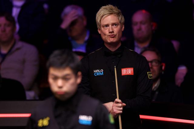 Australia's Neil Robertson reacts whilst playing against China's Pang Junxu during the World Snooker Championship Round One match at The Crucible in Sheffield, northern England on April 22, 2026. The World Snooker Championship 2025 will take place from April 19 to May 5, 2025. (Photo by Darren Staples / AFP)