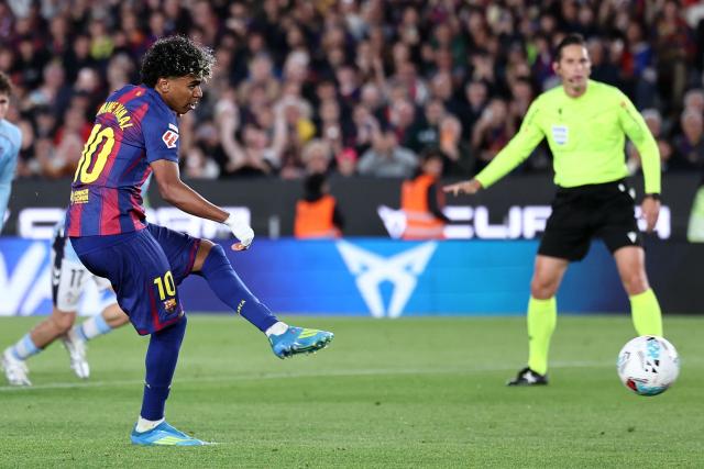 Barcelona's Spanish forward #10 Lamine Yamal scores the opening goal from the penalty spot during the Spanish league football match between FC Barcelona and RC Celta de Vigo at Camp Nou stadium in Barcelona on April 22 , 2026. (Photo by Josep LAGO / AFP)