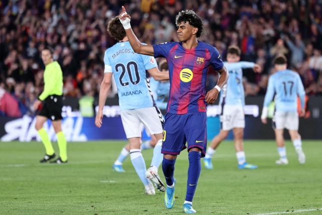 Barcelona's Spanish forward #10 Lamine Yamal demands medical attention after scoring the opening goal from the penalty spot during the Spanish league football match between FC Barcelona and RC Celta de Vigo at Camp Nou stadium in Barcelona on April 22 , 2026. (Photo by Josep LAGO / AFP)