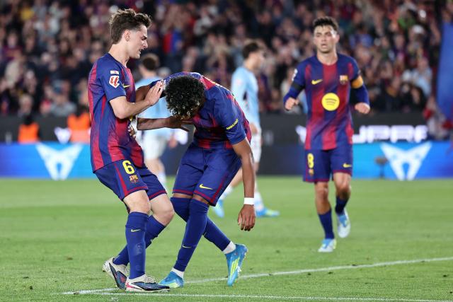 Barcelona's Spanish forward #10 Lamine Yamal goes to the ground after scoring the opening goal from the penalty spot during the Spanish league football match between FC Barcelona and RC Celta de Vigo at Camp Nou stadium in Barcelona on April 22 , 2026. (Photo by Josep LAGO / AFP)