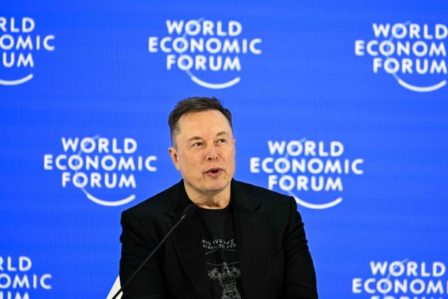 (FILES) CEO of SpaceX and Tesla, South African-Canadian-US businessman Elon Musk speaks during the World Economic Forum (WEF) annual meeting in Davos on January 22, 2026. Tesla reported higher first-quarter profits Wednesday, pointing to recovering demand in North America as it pursues significant investments in autonomous transport and artificial intelligence. (Photo by Fabrice COFFRINI / AFP)