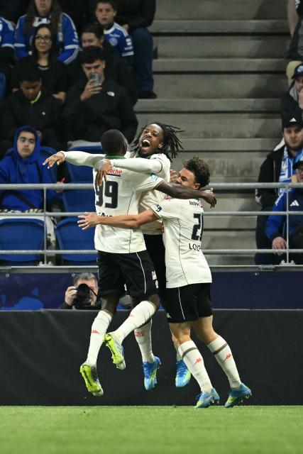 Nice's French forward #11 Elye Wahi (C) celebrates with teammates after scoring Nice's first goal during the French Cup semi-final football match between RC Strasbourg Alsace and OGC Nice at the Stade de la Meinau in Strasbourg, eastern France, on April 22, 2026. (Photo by SEBASTIEN BOZON / AFP)
