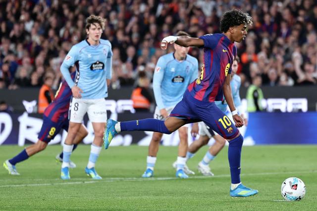 Barcelona's Spanish forward #10 Lamine Yamal scores the opening goal from the penalty spot during the Spanish league football match between FC Barcelona and RC Celta de Vigo at Camp Nou stadium in Barcelona on April 22 , 2026. (Photo by Josep LAGO / AFP)
