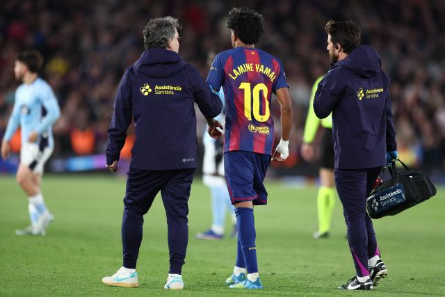 Barcelona's Spanish forward #10 Lamine Yamal leaves the pitch after sustaining an injury during the Spanish league football match between FC Barcelona and RC Celta de Vigo at Camp Nou stadium in Barcelona on April 22 , 2026. (Photo by Josep LAGO / AFP)