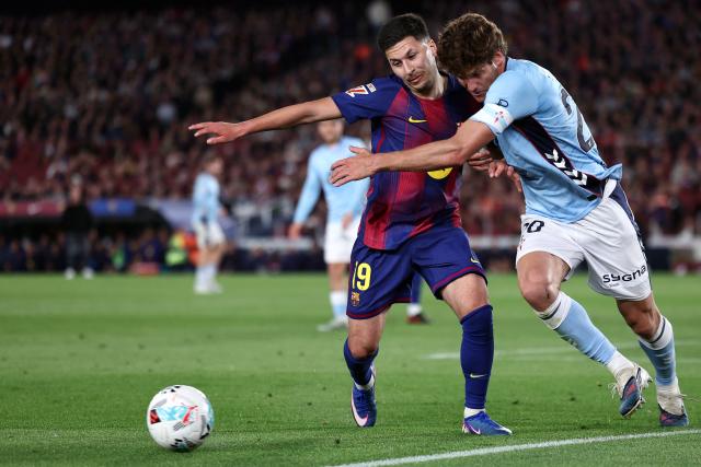 Barcelona's Swedish forward #19 Roony Bardghji and Celta Vigo's Spanish defender #20 Marcos Alonso Mendoza fight for the ball during the Spanish league football match between FC Barcelona and RC Celta de Vigo at Camp Nou stadium in Barcelona on April 22 , 2026. (Photo by Josep LAGO / AFP)