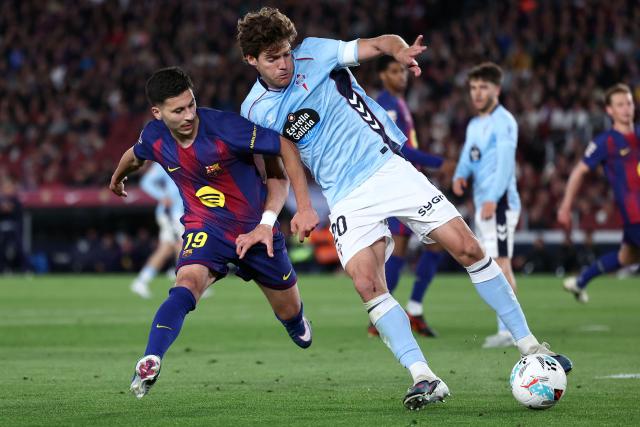 Barcelona's Swedish forward #19 Roony Bardghji and Celta Vigo's Spanish defender #20 Marcos Alonso Mendoza fight for the ball during the Spanish league football match between FC Barcelona and RC Celta de Vigo at Camp Nou stadium in Barcelona on April 22 , 2026. (Photo by Josep LAGO / AFP)