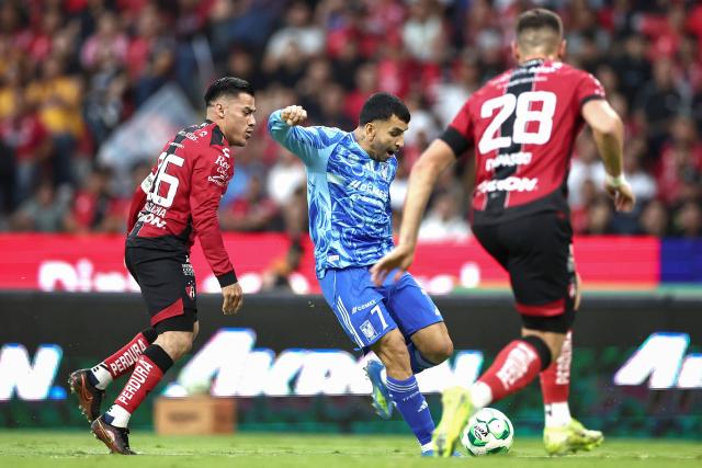 Atlas' midfielder #26 Aldo Rocha and Tigres' Argentine forward #07 Angel Correa fight for the ball during a Mexican League football match between Atlas and Tigres in Guadalajara, Mexico, on April 22, 2026. (Photo by Ulises Ruiz / AFP)