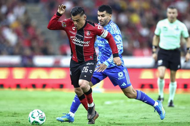 Atlas' midfielder #26 Aldo Rocha and Tigres' Argentine forward #07 Angel Correa fight for the ball during a Mexican League football match between Atlas and Tigres in Guadalajara, Mexico, on April 22, 2026. (Photo by Ulises Ruiz / AFP)
