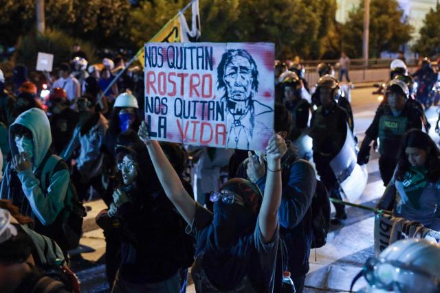 A student holds a sign reading “They take away our identity, they take away our lives” during a protest over transport fares in Lima on April 22, 2026. (Photo by Connie FRANCE / AFP)