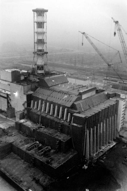 (FILES) Picture, dated 01 October 1986, showing repairs being carried out on the Chernobyl nuclear plant in the Ukraine, following a major explosion on April 26, 1996. Ukraine will on April 30, 2026 mark the 40th anniversary of the Chernobyl accident, the worst civilian nuclear disaster in history. The risks of new radioactive releases still remain today, as the site is threatened by Russian strikes after it invaded the neighbour four years ago. (Photo by Valery ZUFAROV / TASS / AFP)